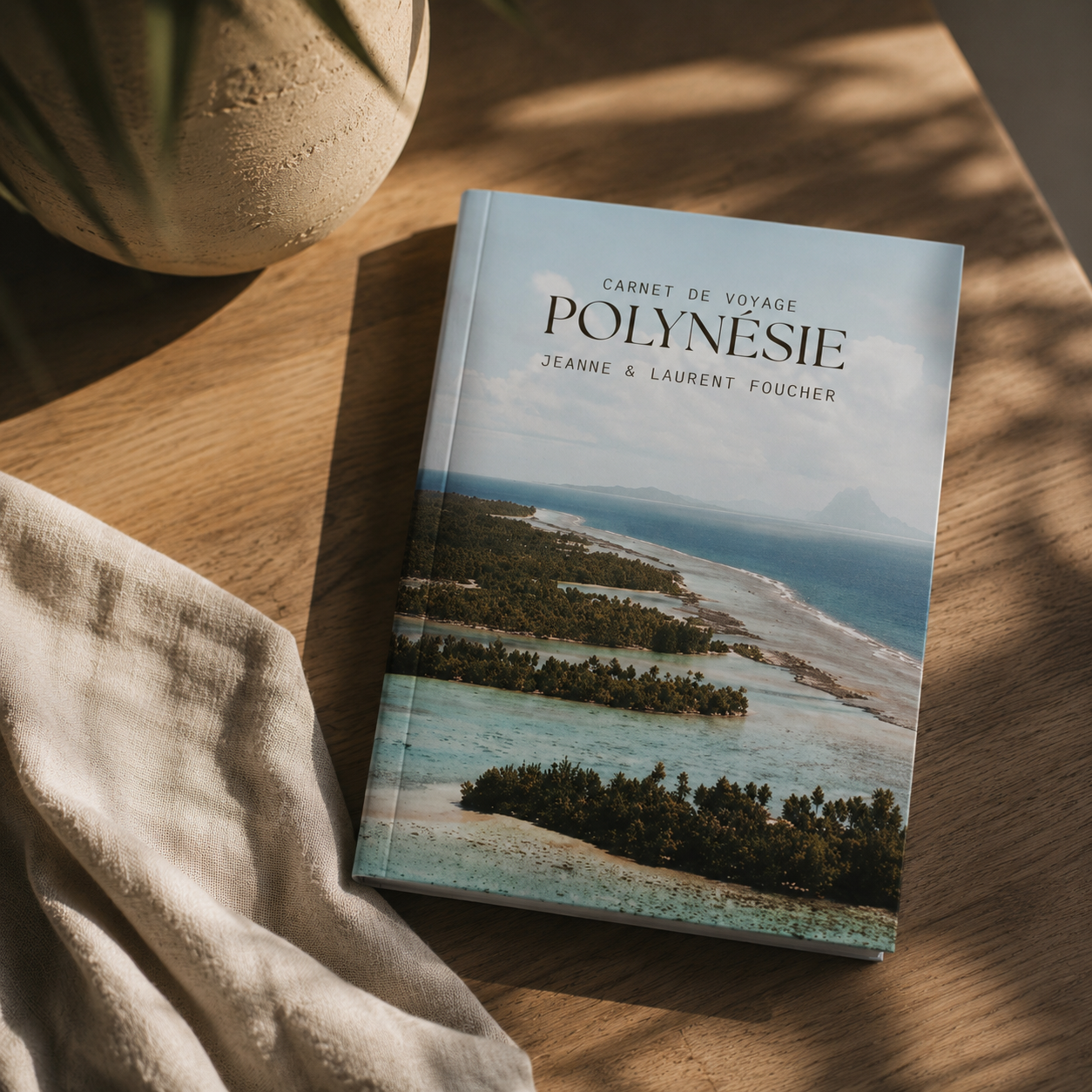 Polynesia travel journal resting on a wooden table